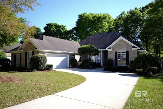 9695 Aspen Cir, Spanish Fort, AL 36527 - ranch-style house featuring concrete driveway, a front yard, a garage, and stone siding