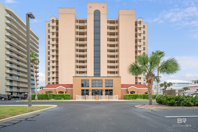 29235 Perdido Beach Blvd Unit 703, Orange Beach, AL 36561 - view of apartment building / complex with uncovered parking