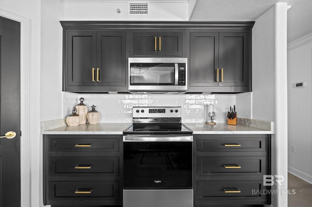 kitchen featuring backsplash, crown molding, and appliances with stainless steel finishes