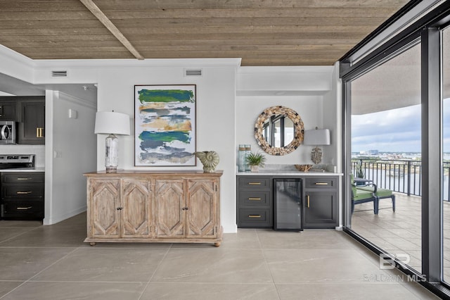 29235 Perdido Beach Blvd Unit 703, Orange Beach, AL 36561 - indoor dry bar with electric stove, stainless steel microwave, beverage cooler, light tile patterned floors, and wood ceiling