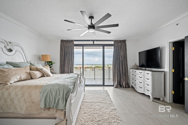 bedroom with ceiling fan, expansive windows, a textured ceiling, and access to outside