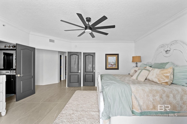 tiled bedroom with ceiling fan, crown molding, a textured ceiling, and sink