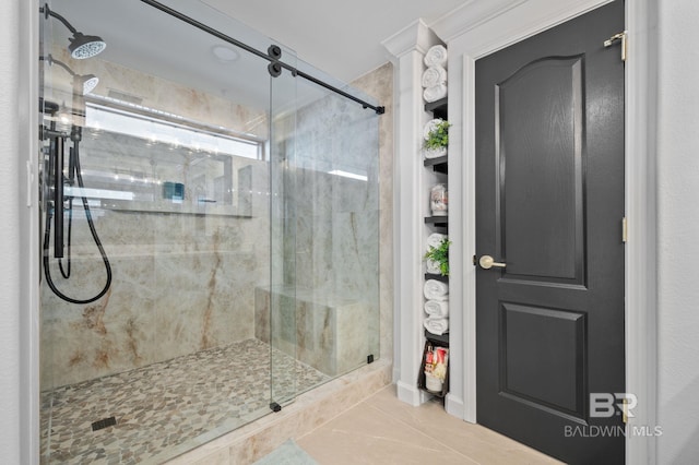 bathroom with tile patterned flooring and a shower with door