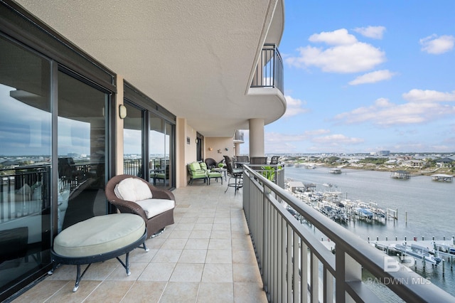 balcony featuring a water view