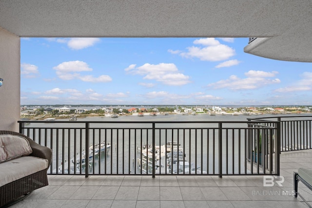 balcony featuring a water view