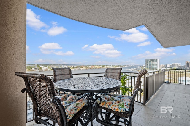 balcony featuring a water view