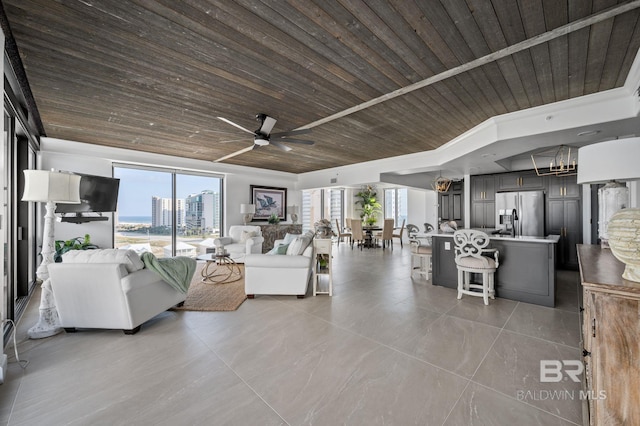 29235 Perdido Beach Blvd Unit 703, Orange Beach, AL 36561 - living room with wooden ceiling, ceiling fan, and light tile patterned floors