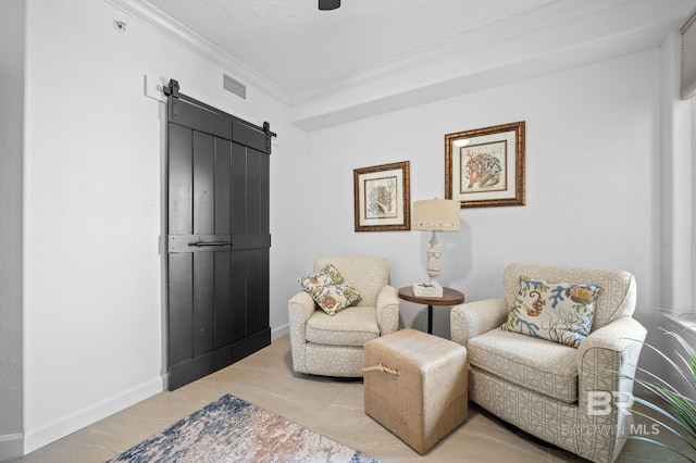 29235 Perdido Beach Blvd Unit 703, Orange Beach, AL 36561 - sitting room with a barn door, ornamental molding, a textured ceiling, and baseboards