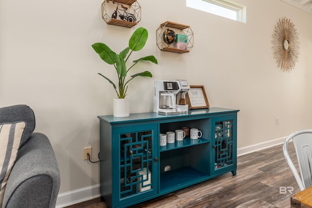 details featuring wood finished floors and baseboards