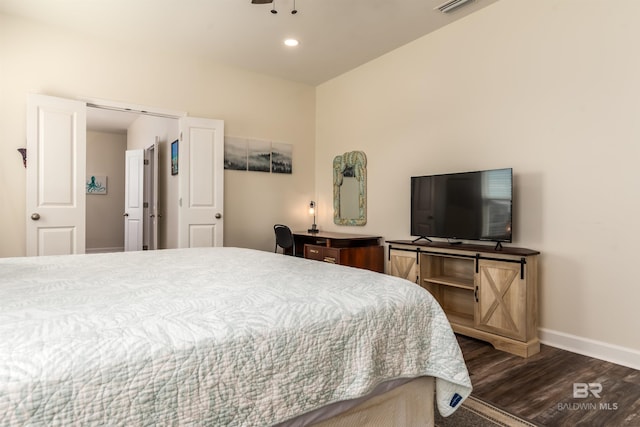 bedroom with recessed lighting, wood finished floors, visible vents, and baseboards