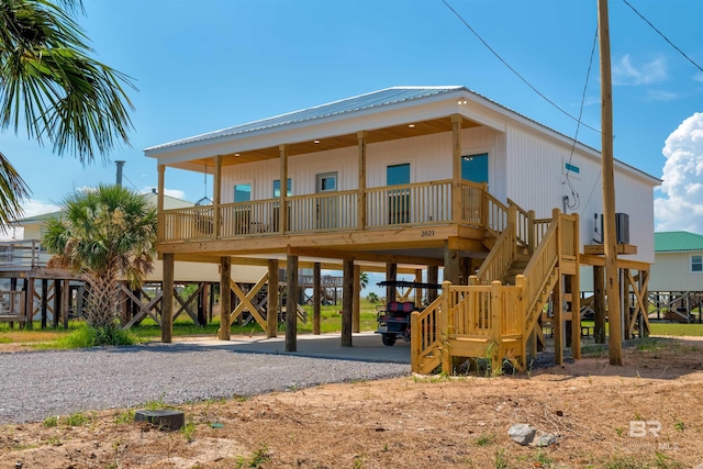 view of playground featuring stairs and covered porch