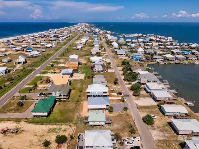 birds eye view of property with a water view and a residential view