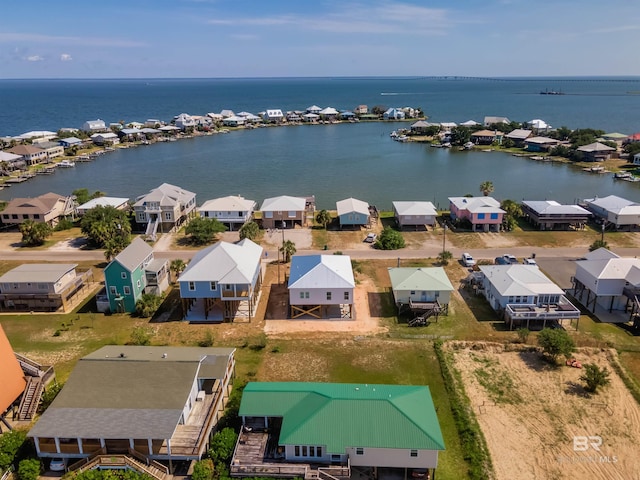 drone / aerial view featuring a residential view and a water view