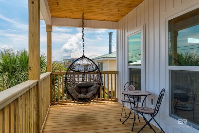 sunroom with wood ceiling