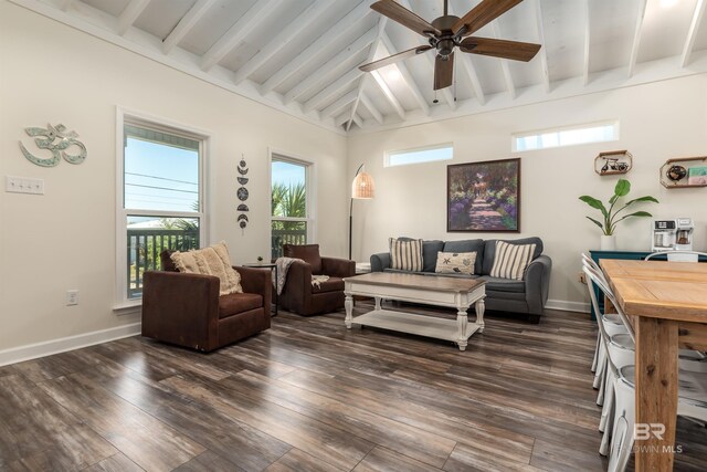 living room featuring a ceiling fan, dark wood-style flooring, lofted ceiling with beams, and baseboards