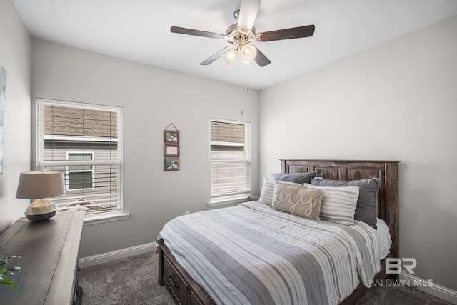 bedroom with baseboards, ceiling fan, and dark colored carpet