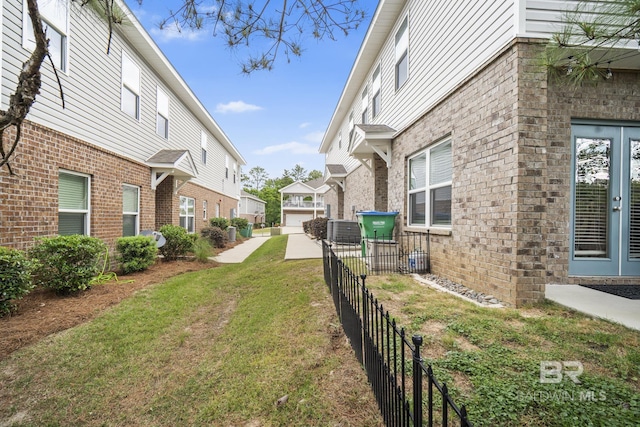 view of yard with fence and a residential view