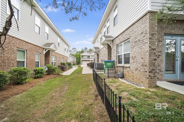 6930 Spaniel Dr Unit B, Spanish Fort, AL 36527 - view of yard with fence and a residential view