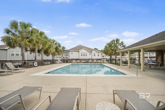 6930 Spaniel Dr Unit B, Spanish Fort, AL 36527 - pool with a patio area, fence, and a residential view