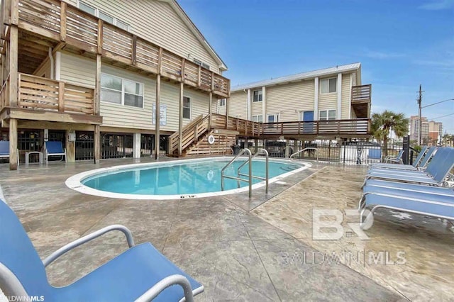 view of swimming pool with a patio