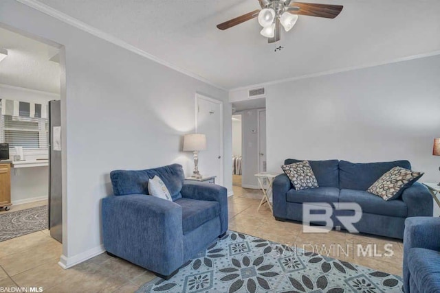 living room featuring ceiling fan, light tile patterned flooring, and crown molding