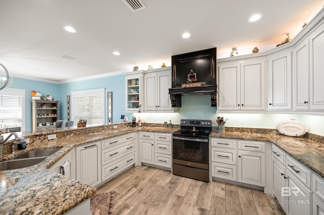 kitchen featuring white cabinetry, sink, ornamental molding, light hardwood / wood-style flooring, and electric range