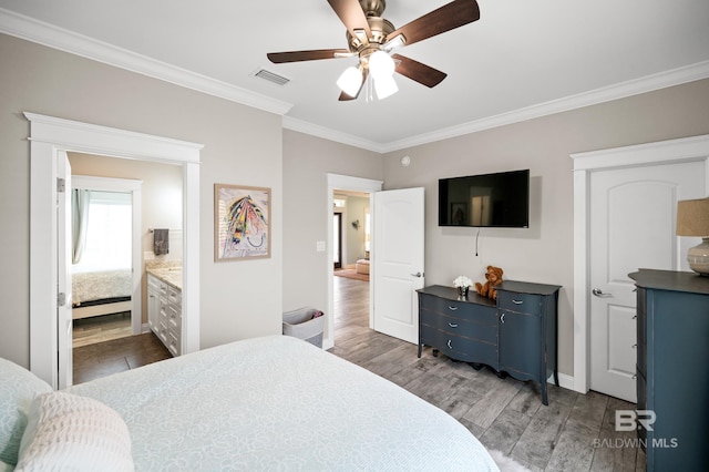 bedroom featuring ensuite bathroom, ceiling fan, crown molding, and dark hardwood / wood-style flooring