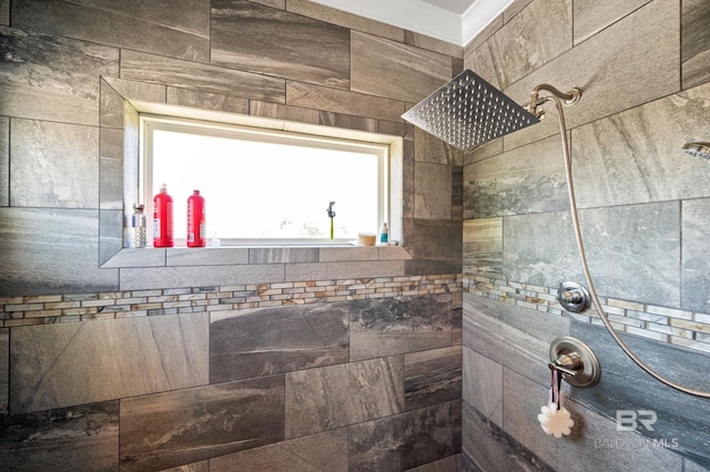 bathroom with a shower and tile walls