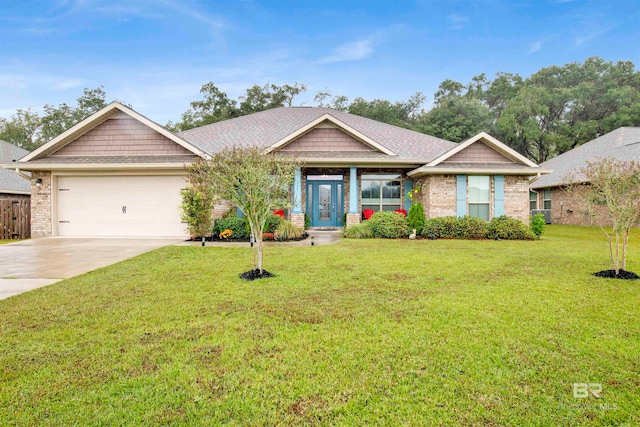 view of front facade with a garage and a front lawn