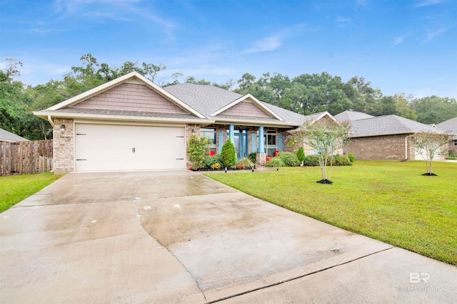 view of front of property with a garage and a front yard