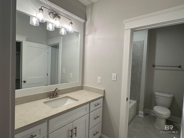 full bathroom with vanity, tile patterned floors, toilet, and tiled shower / bath