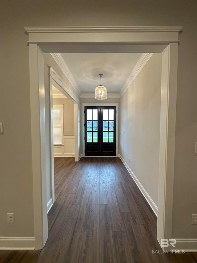 doorway to outside featuring dark hardwood / wood-style flooring, french doors, and ornamental molding