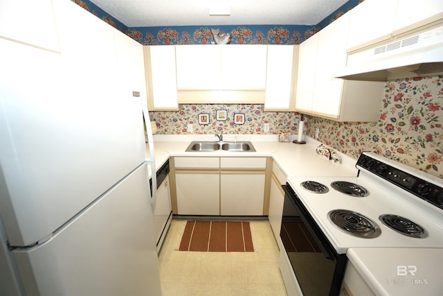 kitchen with white appliances and sink