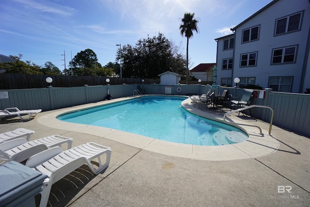 view of pool featuring a patio