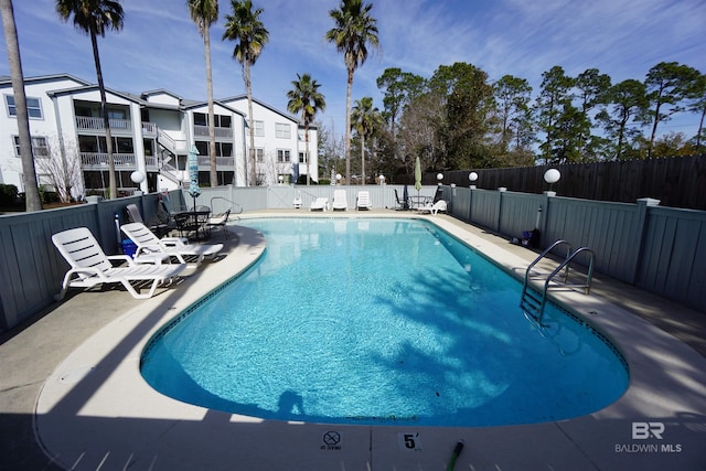 view of swimming pool featuring a patio