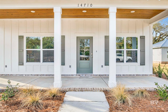 doorway to property featuring a porch