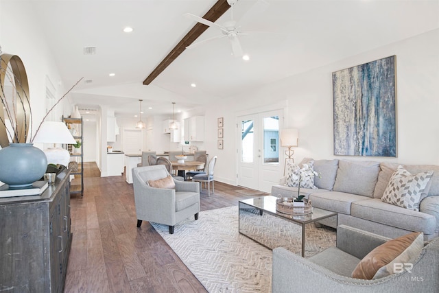 living room with dark hardwood / wood-style floors, ceiling fan, and lofted ceiling with beams