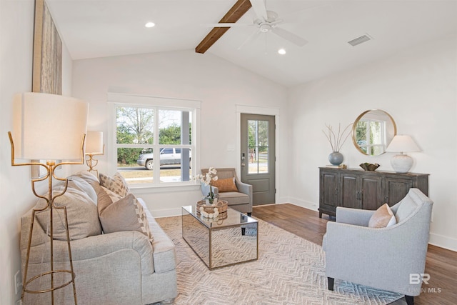 living room featuring ceiling fan, light hardwood / wood-style flooring, and lofted ceiling with beams