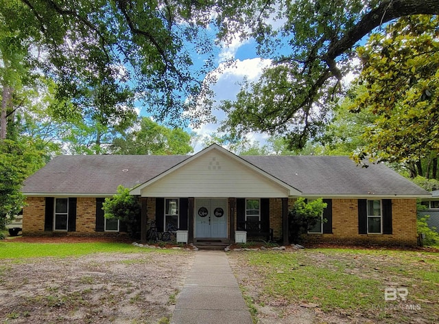224 Cache Cir, Chickasaw, AL 36611 - ranch-style house featuring brick siding and covered porch