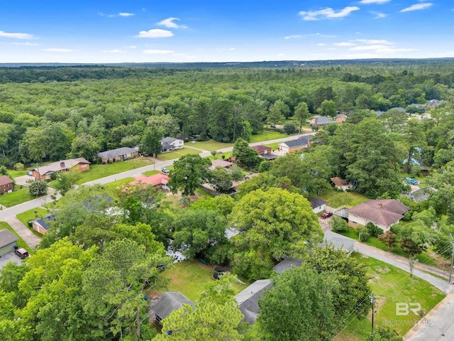 224 Cache Cir, Chickasaw, AL 36611 - aerial perspective of suburban area with a heavily wooded area