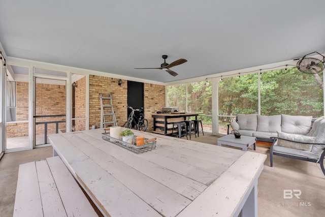 224 Cache Cir, Chickasaw, AL 36611 - sunroom / solarium featuring outdoor dining area, an outdoor living space, and ceiling fan