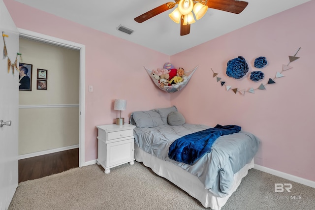 224 Cache Cir, Chickasaw, AL 36611 - bedroom featuring light colored carpet, ceiling fan, and baseboards