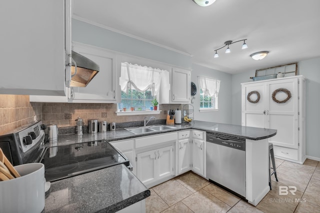 224 Cache Cir, Chickasaw, AL 36611 - kitchen with stainless steel appliances, a sink, white cabinetry, light tile patterned floors, and decorative backsplash