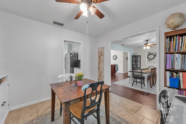 224 Cache Cir, Chickasaw, AL 36611 - dining space featuring a ceiling fan, light tile patterned floors, and baseboards