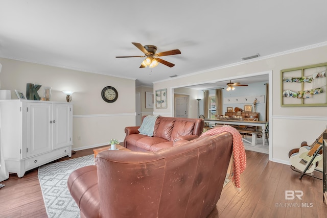 224 Cache Cir, Chickasaw, AL 36611 - living room with a ceiling fan, wood finished floors, baseboards, and crown molding