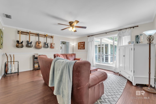 224 Cache Cir, Chickasaw, AL 36611 - living area featuring a ceiling fan, wood finished floors, and ornamental molding