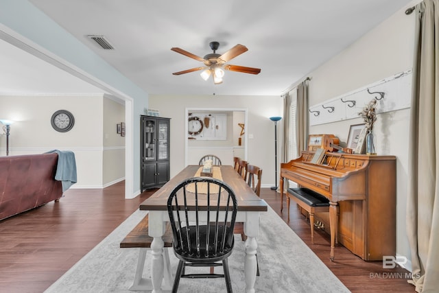 224 Cache Cir, Chickasaw, AL 36611 - dining space with ceiling fan, dark wood-type flooring, and baseboards