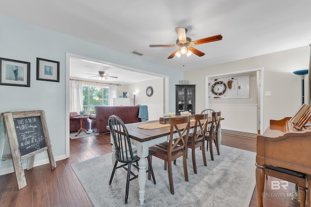 224 Cache Cir, Chickasaw, AL 36611 - dining space with ceiling fan, wood finished floors, and baseboards
