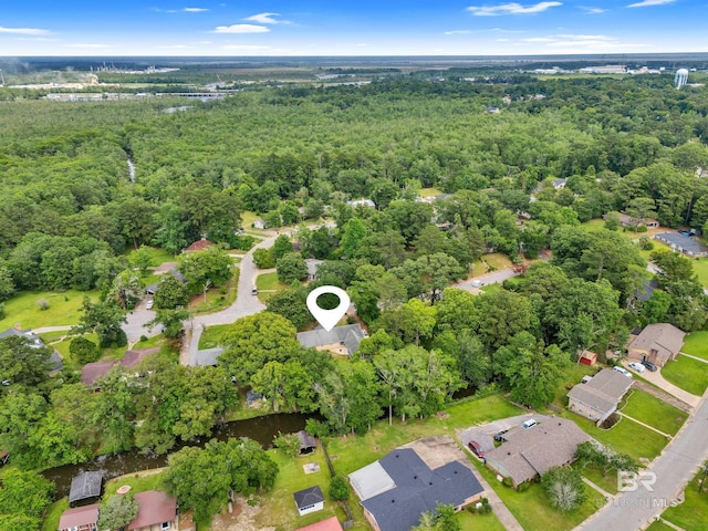 224 Cache Cir, Chickasaw, AL 36611 - aerial view of property and surrounding area featuring a forest