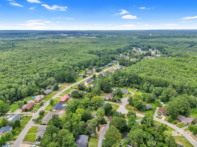 224 Cache Cir, Chickasaw, AL 36611 - aerial view of property and surrounding area featuring a forest